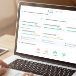Person using laptop showing Core Web Vitals metrics and website performance dashboard